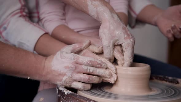 Small Child Girl with Her Charming Family Molding Wet Clay in Cr