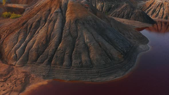 Aerial View of a Landscape Similar To the Planet Mars with Red Hills and Rivers with Red Water