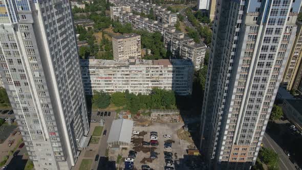 Drone Flying in Between Two Big Skyscrapers Sunny Evening Kyiv Ukraine