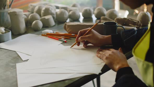 Woman Potter Is Drawing Vase