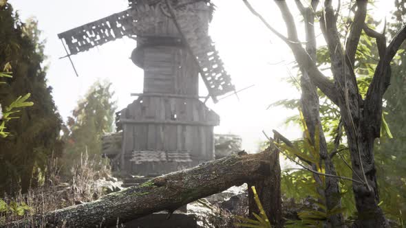 Old Traditional Wooden Windmill in the Forest alt