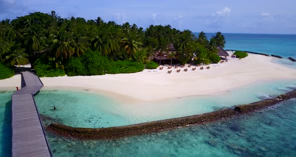 Luxury drone abstract view of a white sandy paradise beach and blue ocean background in colorful 4K