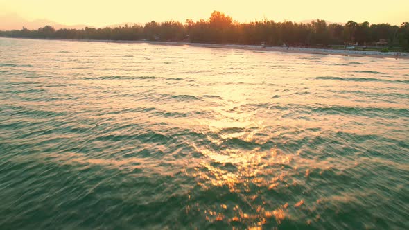 4K Aerial view of drone move on beautiful sea. sunset over ocean waves.