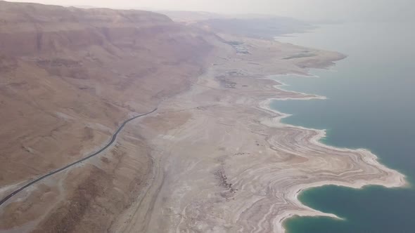 Aerial view of the Dead Sea and the surrounding cliff from the desert