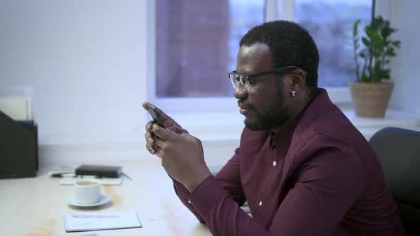 African Man Use Smartphone for Online Shopping Browsing Social Media Searching Information Spbas