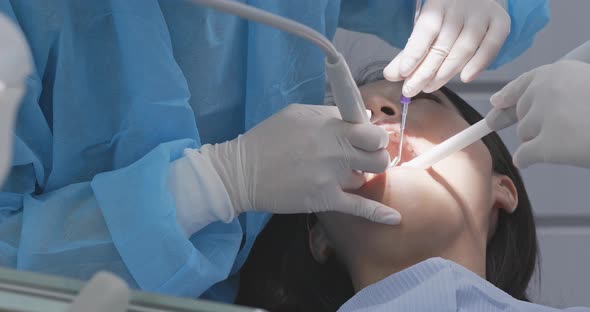 Woman checking on her teeth at dental clinic