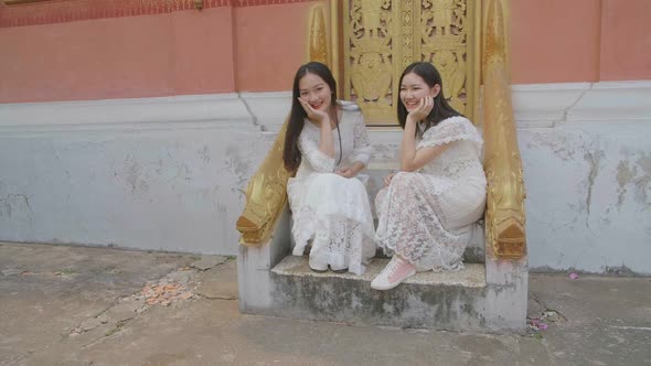 Two Asian Girls Pose On Stairs Of Temple