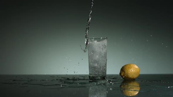 Carbonated liquid pouring into glass filled with ice - ultra slow mo 1500fps - LIQUID POUR 