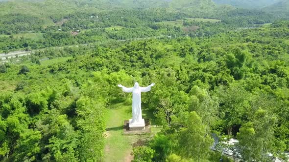 Drone Shot of Mount Zion Pilgrim Mountain with a Gigantic Scuplture of Jesus Christ behind a Scenic