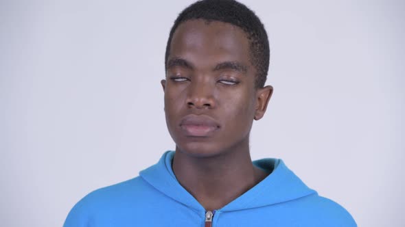 Face of Young Stressed African Man Looking Tired and Bored