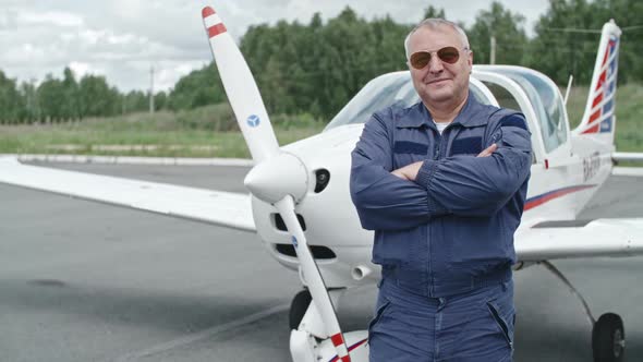 Mature Pilot Proud of his Plane