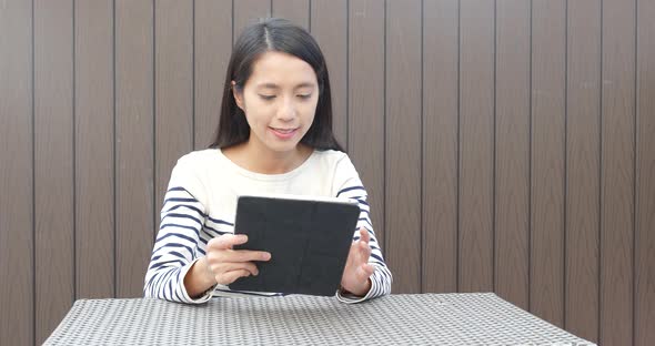 Woman working on tablet computer