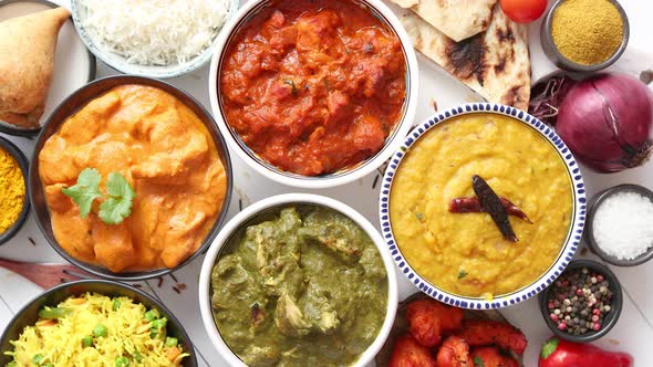 Assorted Indian Various Food with Spices, Rice and Fresh Vegetables