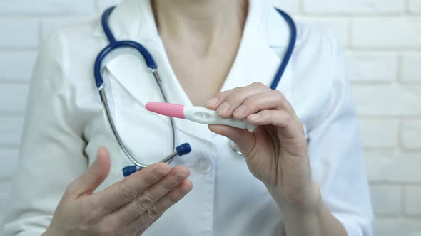 Doctor with Pregnancy Test