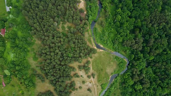 Beautiful aerial birdseye view of Sventaja river in sunny summer day, wide angle high altitude drone