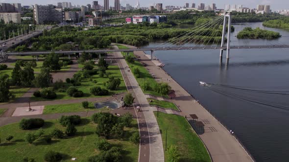 Drone Flight Along the City Embankment Summer River City