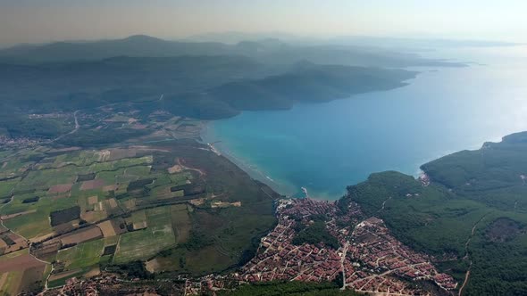 A Small City on a Forested Bay and Fertile Alluvial Plain by the Sea