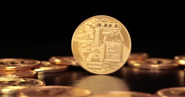 Gold Bit Coin BTC Cryptocurrency Coins on a Black Background