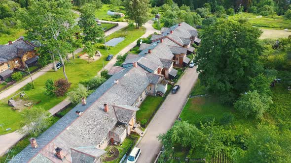 Old Wooden Houses Built for Paper Mill Workers in Ligatne. Wooden Row House 4K Aerial Shot	