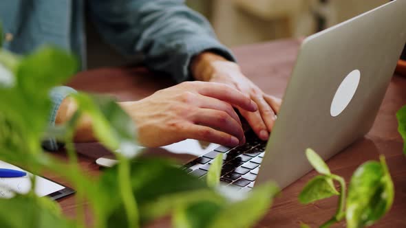 Florist Man Using Laptop