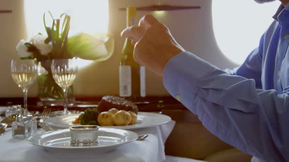 Businessman taking photo of meal with mobile phone 4k