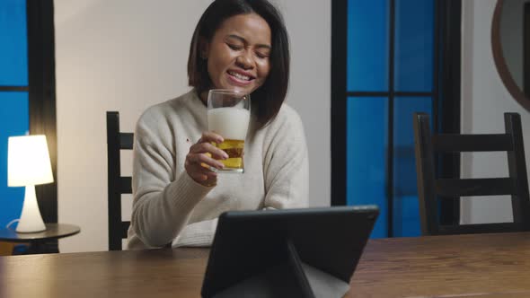 Asian lady drinking beer having fun happy night party event online celebration via video call