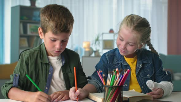 Friendship Two Little Friends Spend Free Time Together at Home Drawing with Colorful Pencils in