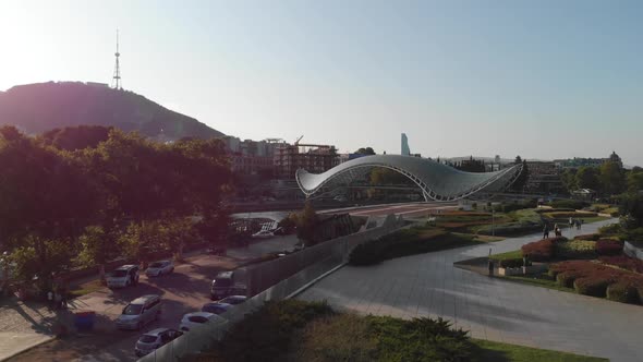 Aerial Shooting of the City Center of Tbilisi in Georgia. Peace Bridge, The Camera Flies