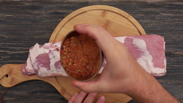 Top View of the Raw Ribs on the Wooden Board Sprinkled with the Mix of Spices