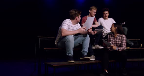 Teenagers rehearsing in a theatre