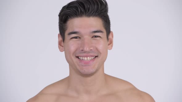Face of Happy Young Handsome Muscular Shirtless Man Smiling