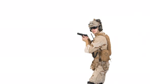 Soldier Walking Aiming with a Pistol and Shooting To Camera on White Background