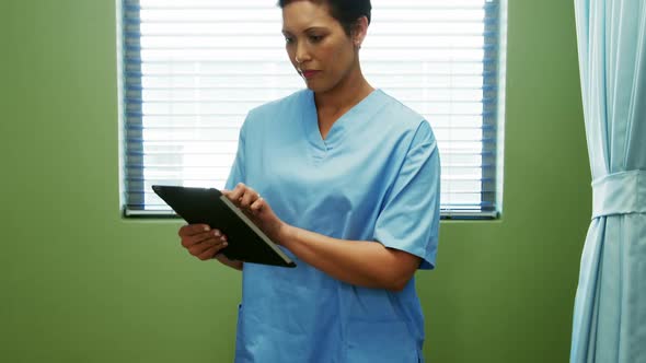 Nurse using digital tablet