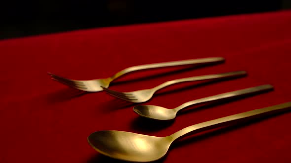 Golden Spoon Isolated on Red Background