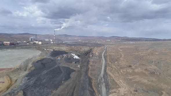 Aerial view of copper plant in Karabash city. Smoke comes out of the chimney 25