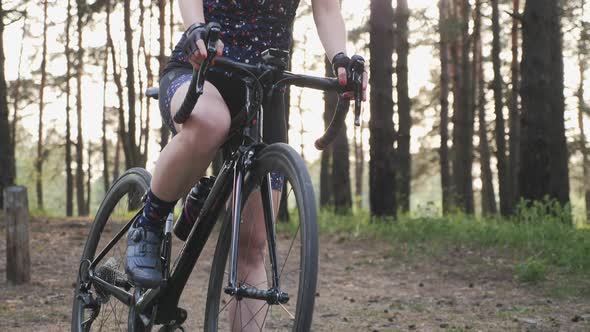 Woman cycling. Attractive cute triathlete girl close up shot before the ride. Cycling and triathlon