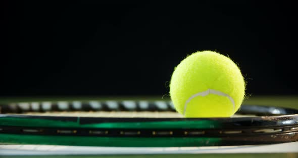 Tennis ball on racket in court 4k