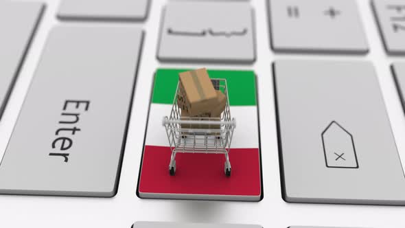 Boxes with MADE IN ITALY Text and Shopping Cart on the Keyboard