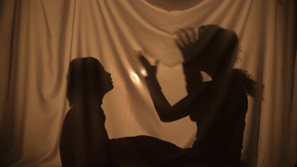 Unrecognizable Woman and Boy Telling Stories Using Shadow Play Talking and Parenting