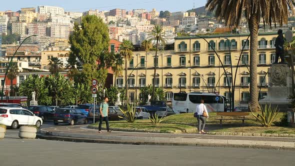 Student walking down beautiful street in Naples city center, tourism, travel