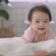 Slow Motion Happy Asian Baby Crawls In The Living Room. Infant Baby Plays with Family. - VideoHive Item for Sale
