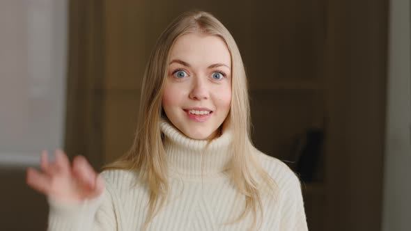 Portrait of Attractive Young Caucasian Millennial Girl Smiles at Camera Showing Hand OK Sign