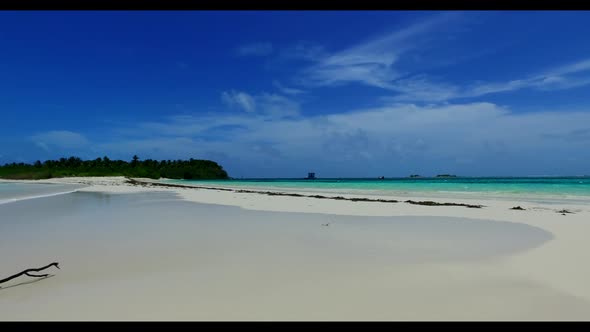 Aerial drone shot seascape of marine coast beach break by turquoise sea with white sand background o