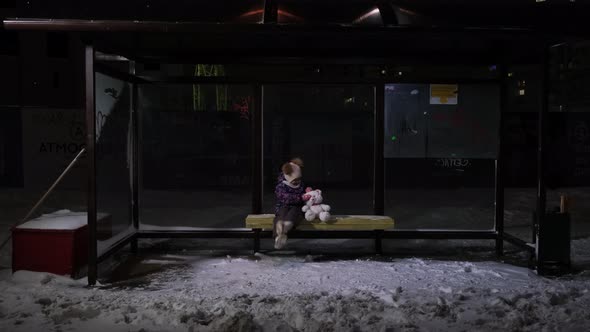 Little Girl Alone at the Bus Stop