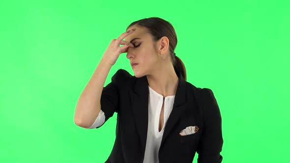 Woman Is Upset and Tired, Takes Off Her Glasses, Green Screen
