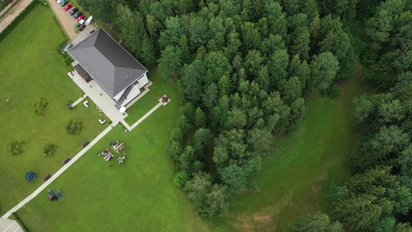 Top View of the Wedding Venue in a Green Field and a House in the Forest. Wedding Ceremony with