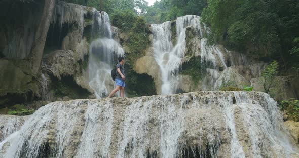 Hiker Walking At Waterfall