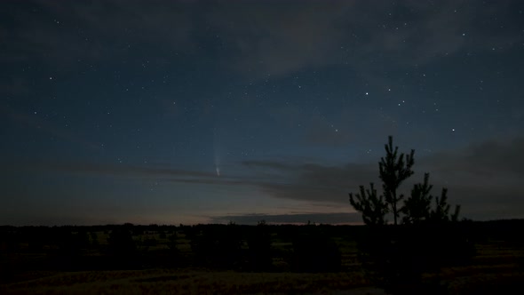 The Comet Moves Across the Night Sky Among the Stars