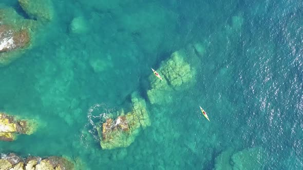 Aerial Shot Of Two Kayaks In Blue Water. Travel Costa Brava, Blanes, Spain.