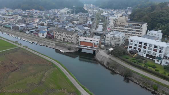 Early morning aerial shot of Kinosaki Onsen, famous small hot spring town in Hyogo prefecture, falli